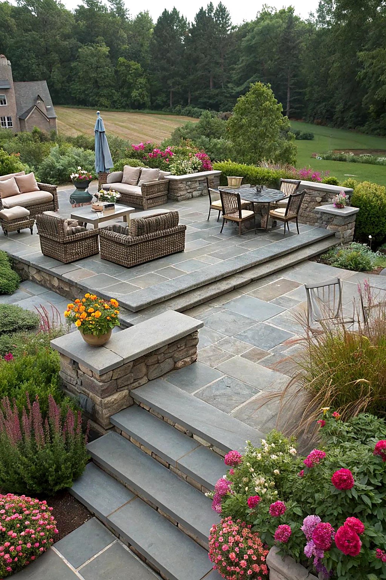 Terraced bluestone patio with stone seat walls and steps